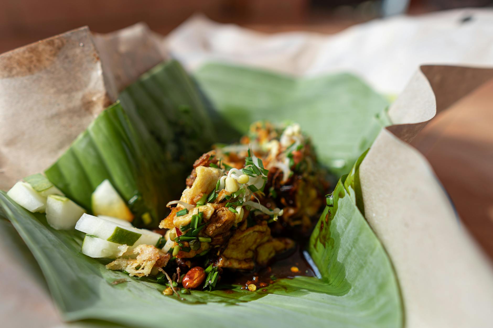 Traditional banana leaf rice served with vegetable curries, sambar, and accompaniments at an Indian vegetarian restaurant in Malaysia