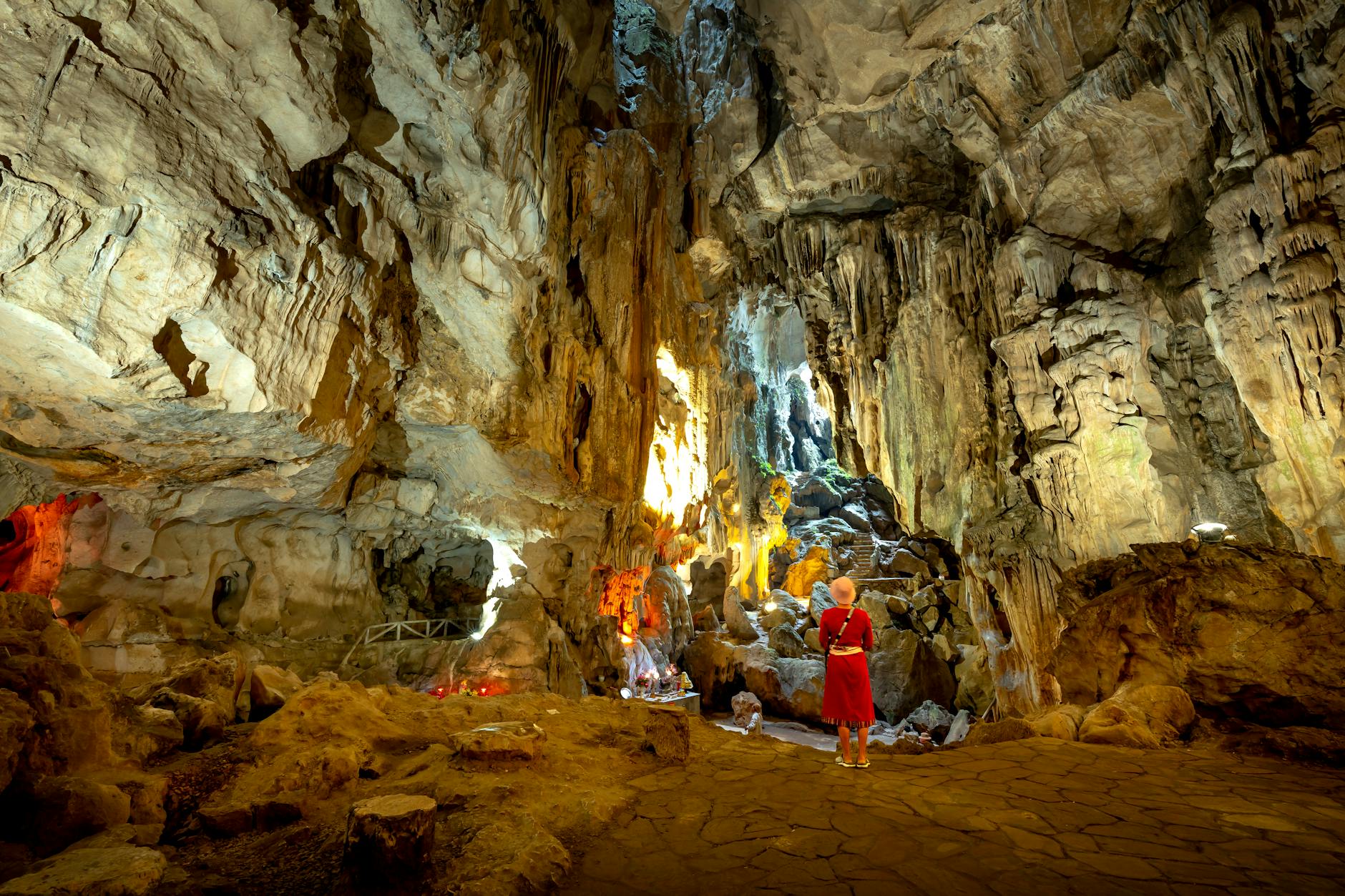 Interior of Batu Caves in Malaysia with natural light streaming through the limestone ceiling