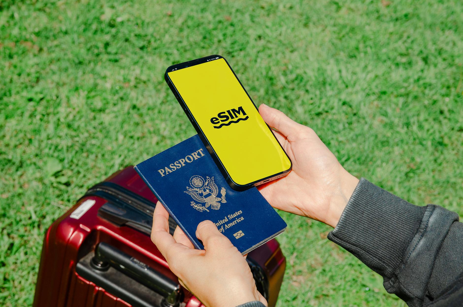 Malaysia SIM card tourist eSIM setup with smartphone and passport for travel connectivity