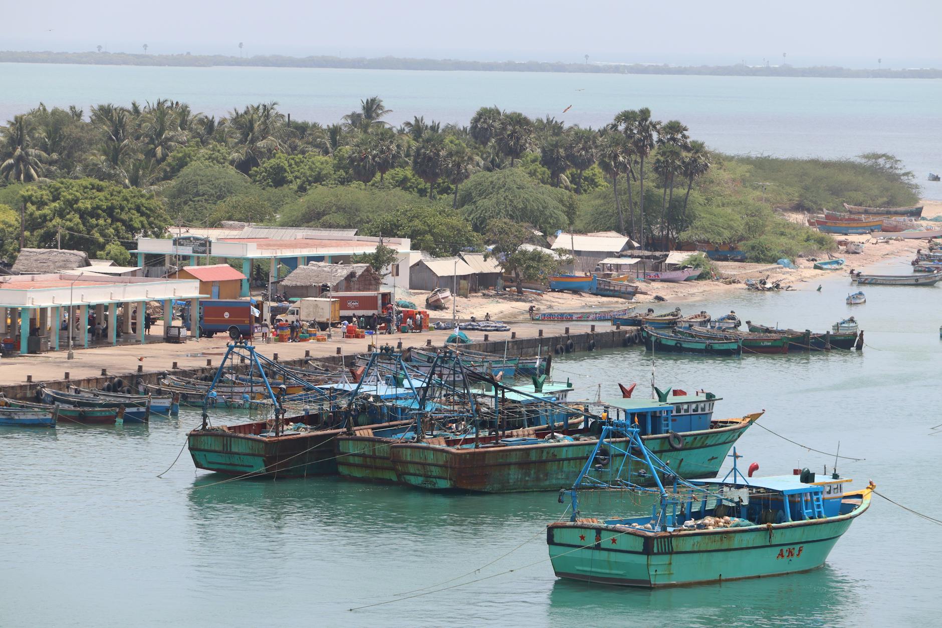 Colorful fishing boats in a traditional tropical harbor village at Pangkor Island Malaysia