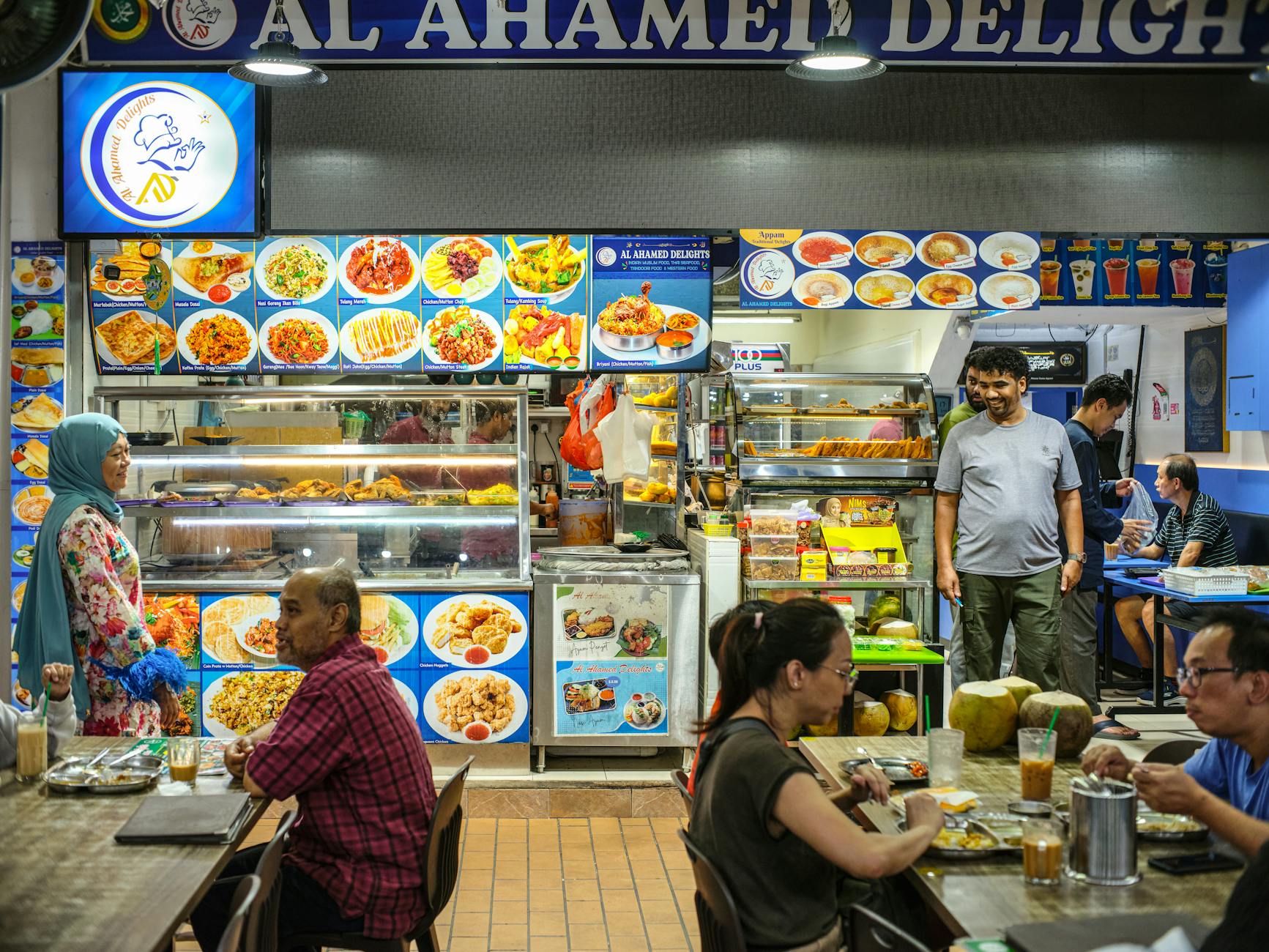 Bustling halal hawker center in Malaysia serving diverse halal food options for travelers