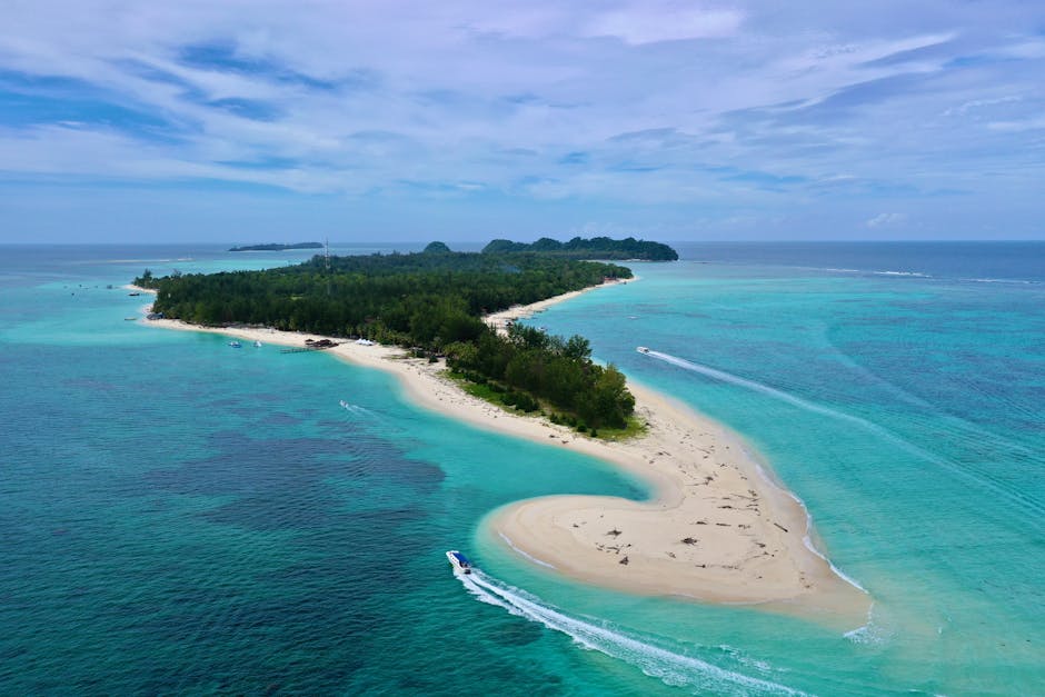 Aerial view of Mantanani Island Malaysia with turquoise waters and sandy beach perfect for snorkeling
