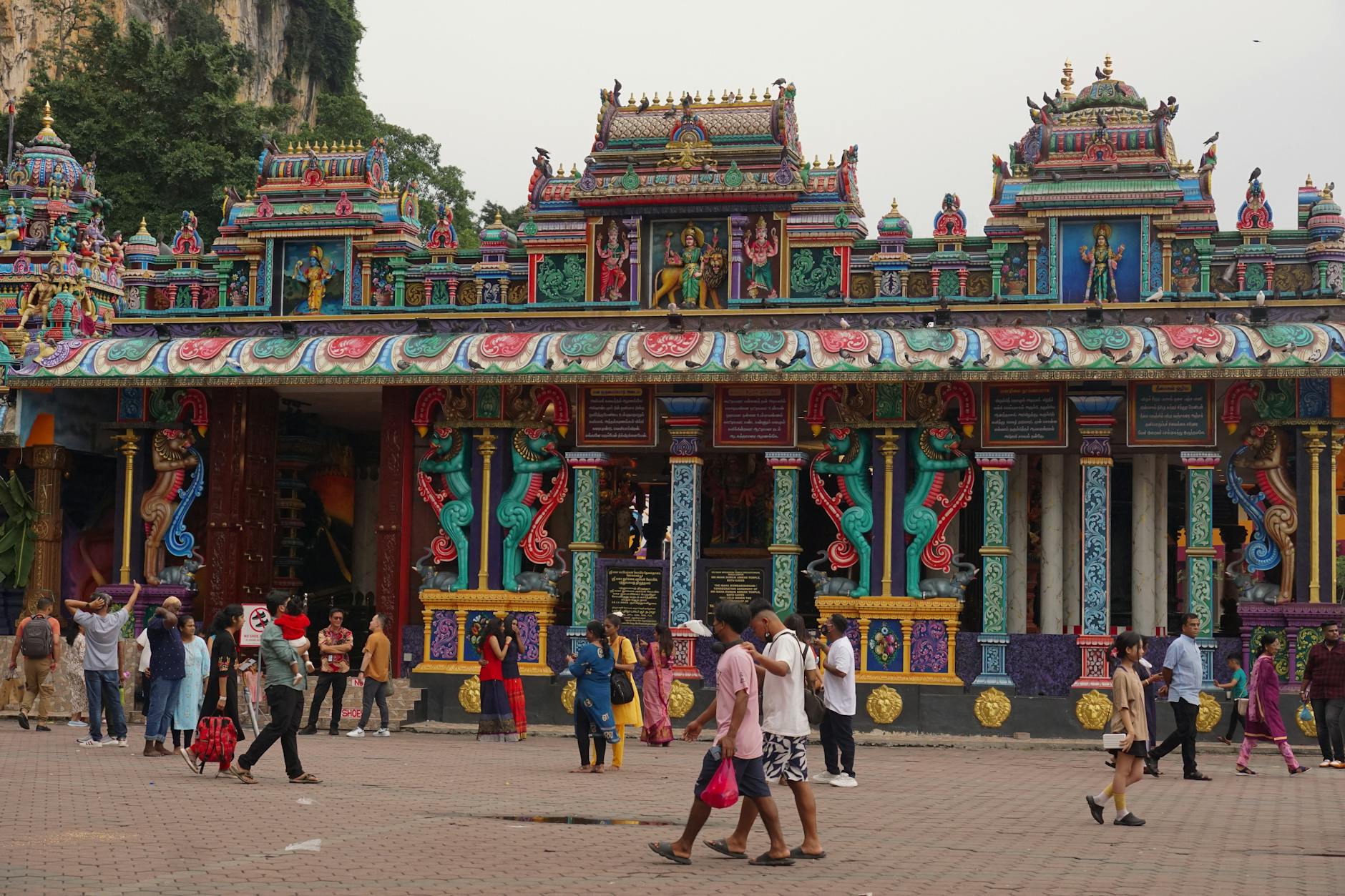 Tourists safely visiting the colorful Sri Maha Mariamman Temple - Malaysia is safe for visitors