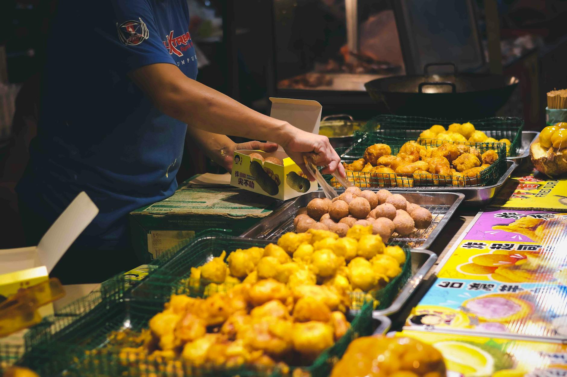 Malaysian street food hawker stall serving local dishes at a night market in Johor Bahru