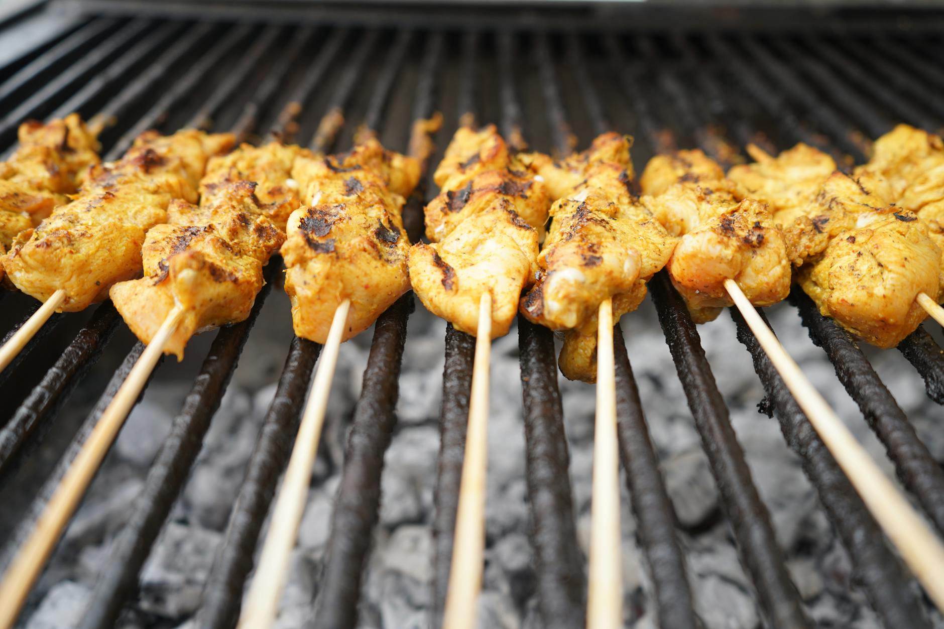 Satay grilled meat skewers over charcoal fire a must try Malaysian street food