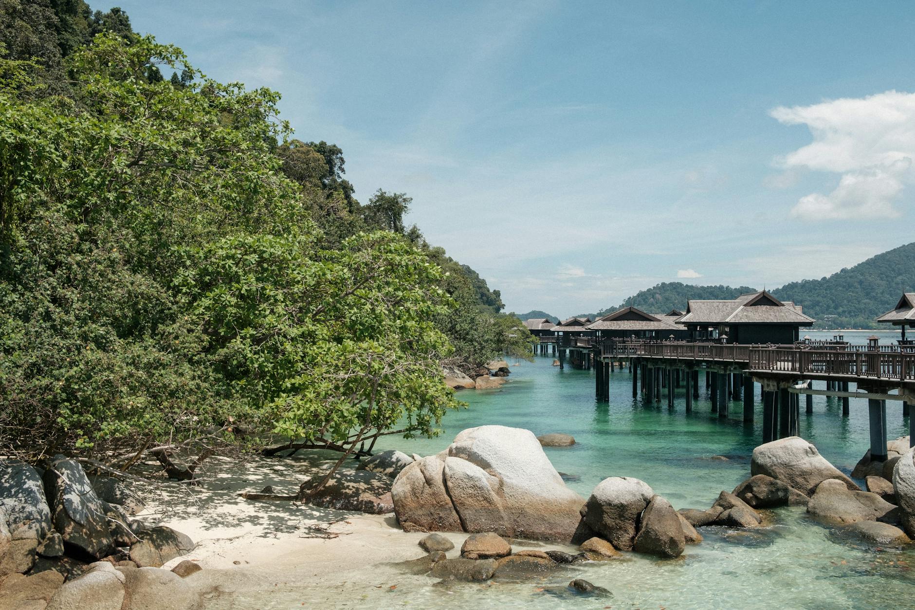 Crystal clear turquoise waters and white sand beach at a tropical island off the east coast of Malaysia
