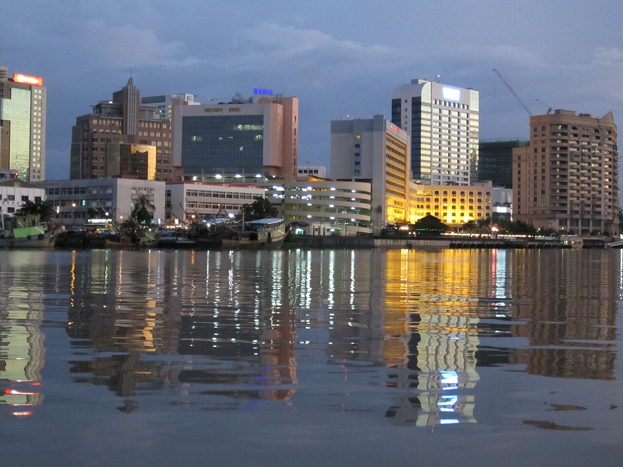 Kuching waterfront promenade along the Sarawak River with colonial buildings