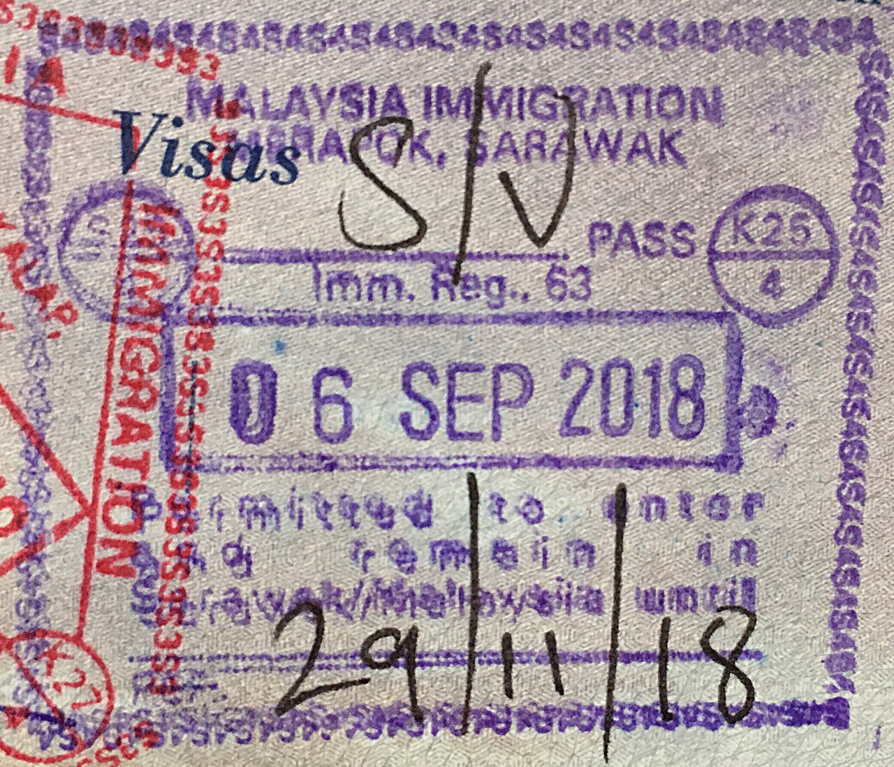 Malaysian immigration stamp in a passport at Kuala Lumpur International Airport