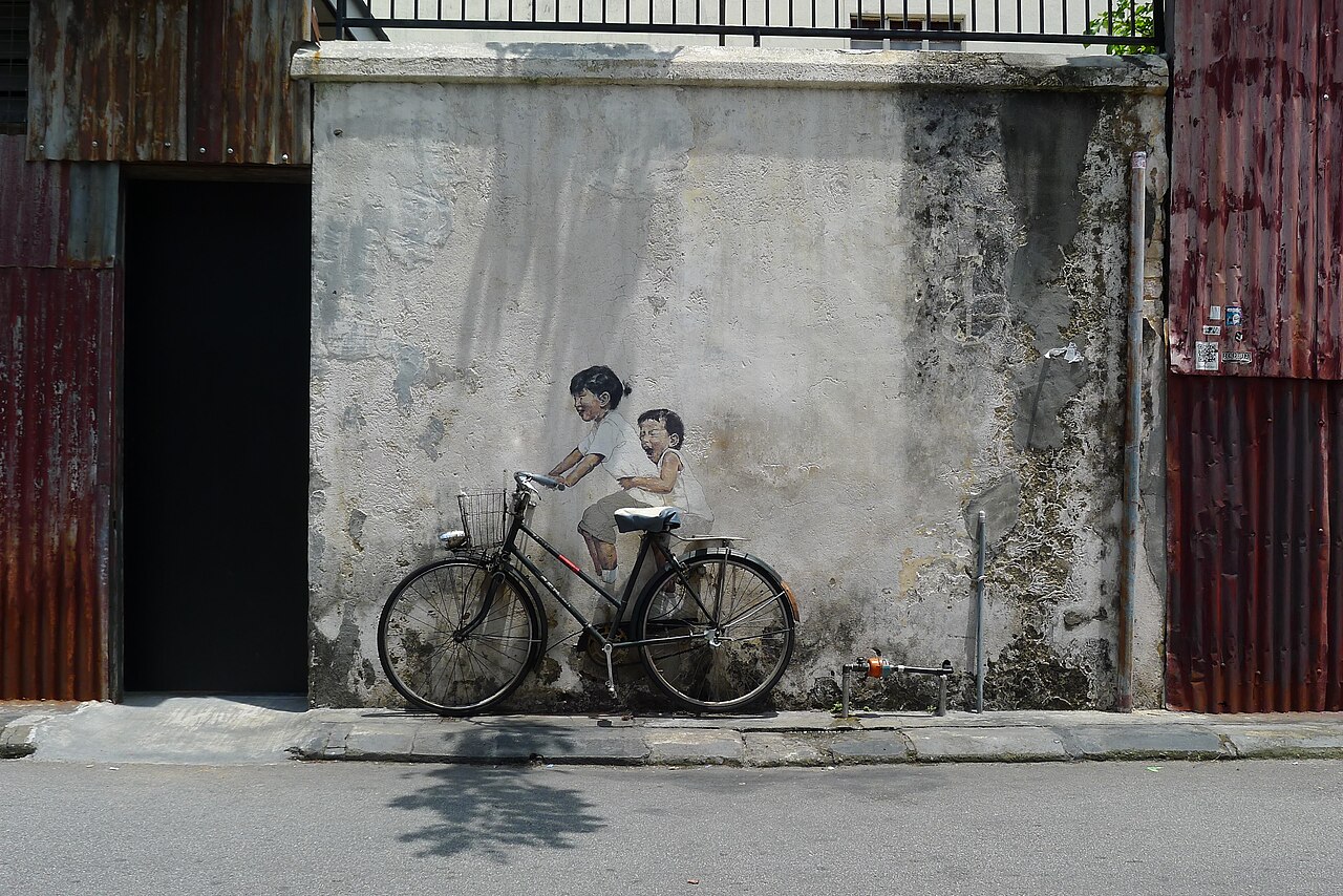 Famous street art mural on a heritage shophouse wall in George Town Penang Malaysia