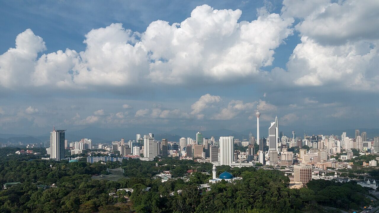 Kuala Lumpur skyline with the Petronas Twin Towers at dusk, Malaysia
