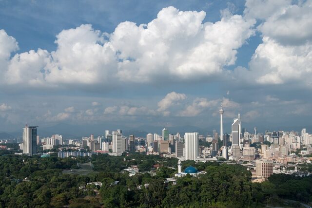 Kuala Lumpur skyline with the Petronas Twin Towers at dusk, Malaysia