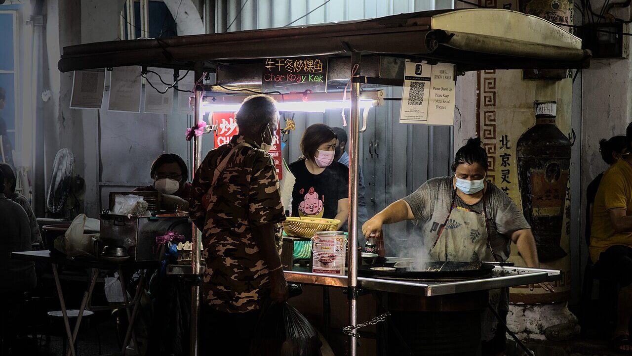 Hawker stall cooking char koay kak in George Town, Penang, Malaysia