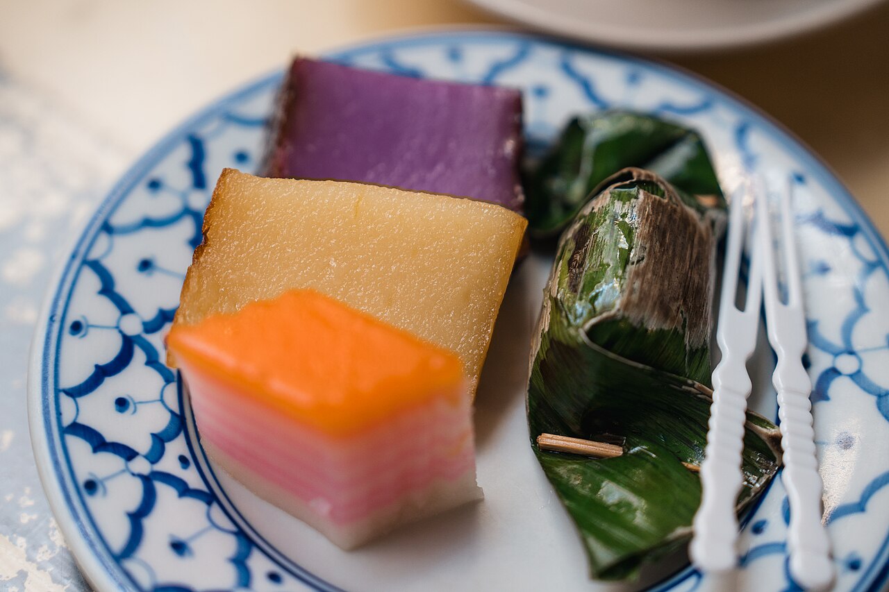 A tray of brightly coloured steamed and layered nyonya kuih