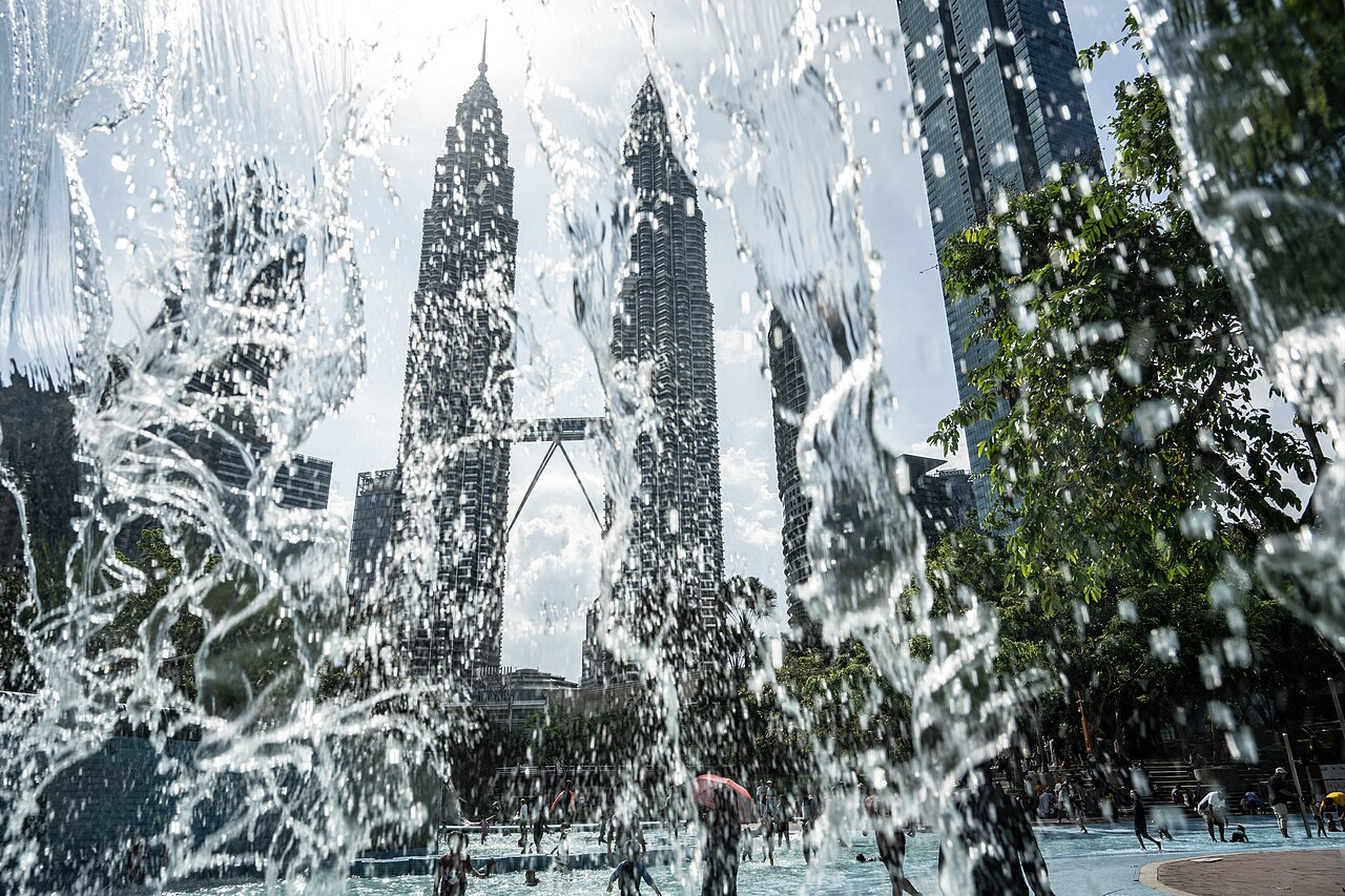 Infinity pool at KLCC Park with the Petronas Twin Towers rising behind it in Kuala Lumpur, Malaysia