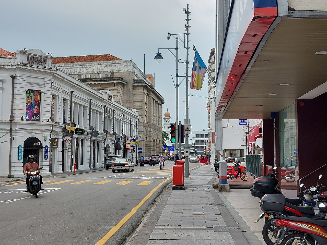 Beach Street in George Town, with colonial-era buildings on one side and shophouses on the other