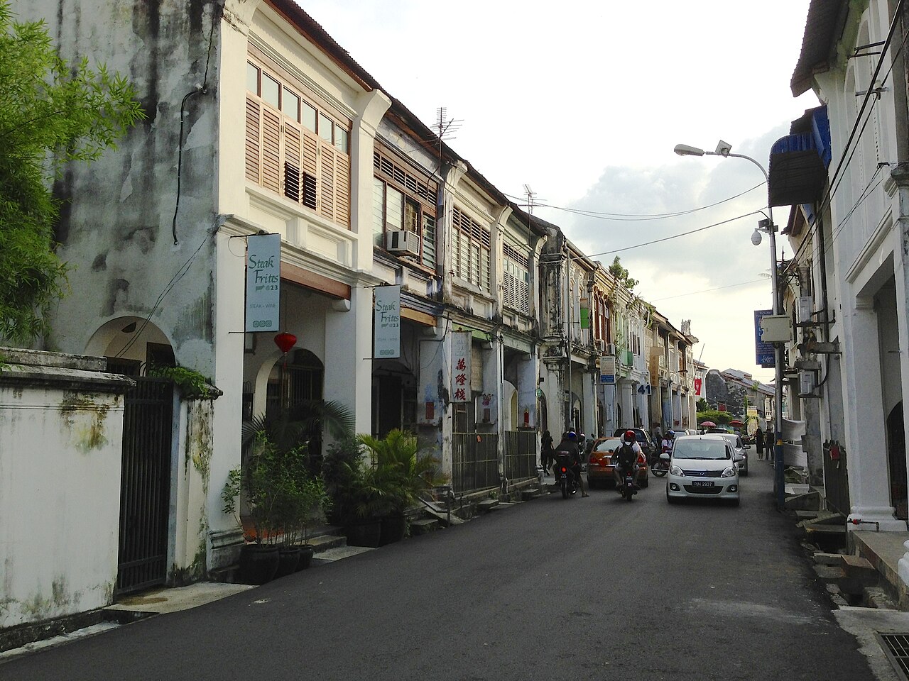 A traveler walking the heritage streets of George Town, Penang, a popular base for solo trips in Malaysia