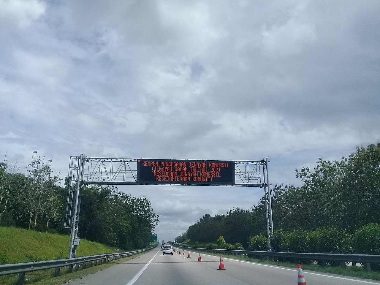 An overhead gantry sign above the North-South Expressway, the road that carries the Hari Raya exodus