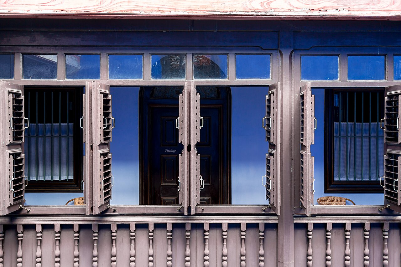 The indigo-painted upper storey and shuttered windows of the Cheong Fatt Tze Blue Mansion in George Town
