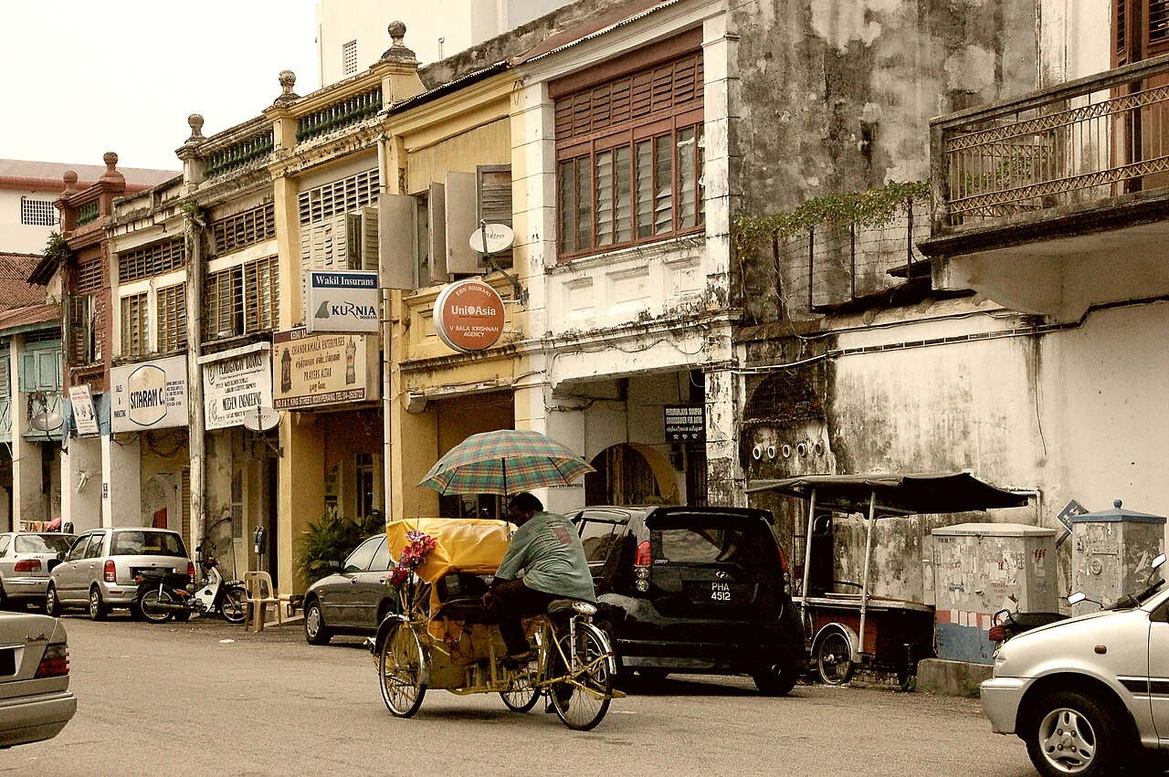 Heritage shophouse-lined street in Georgetown, Penang, typical of short-term rental conversions