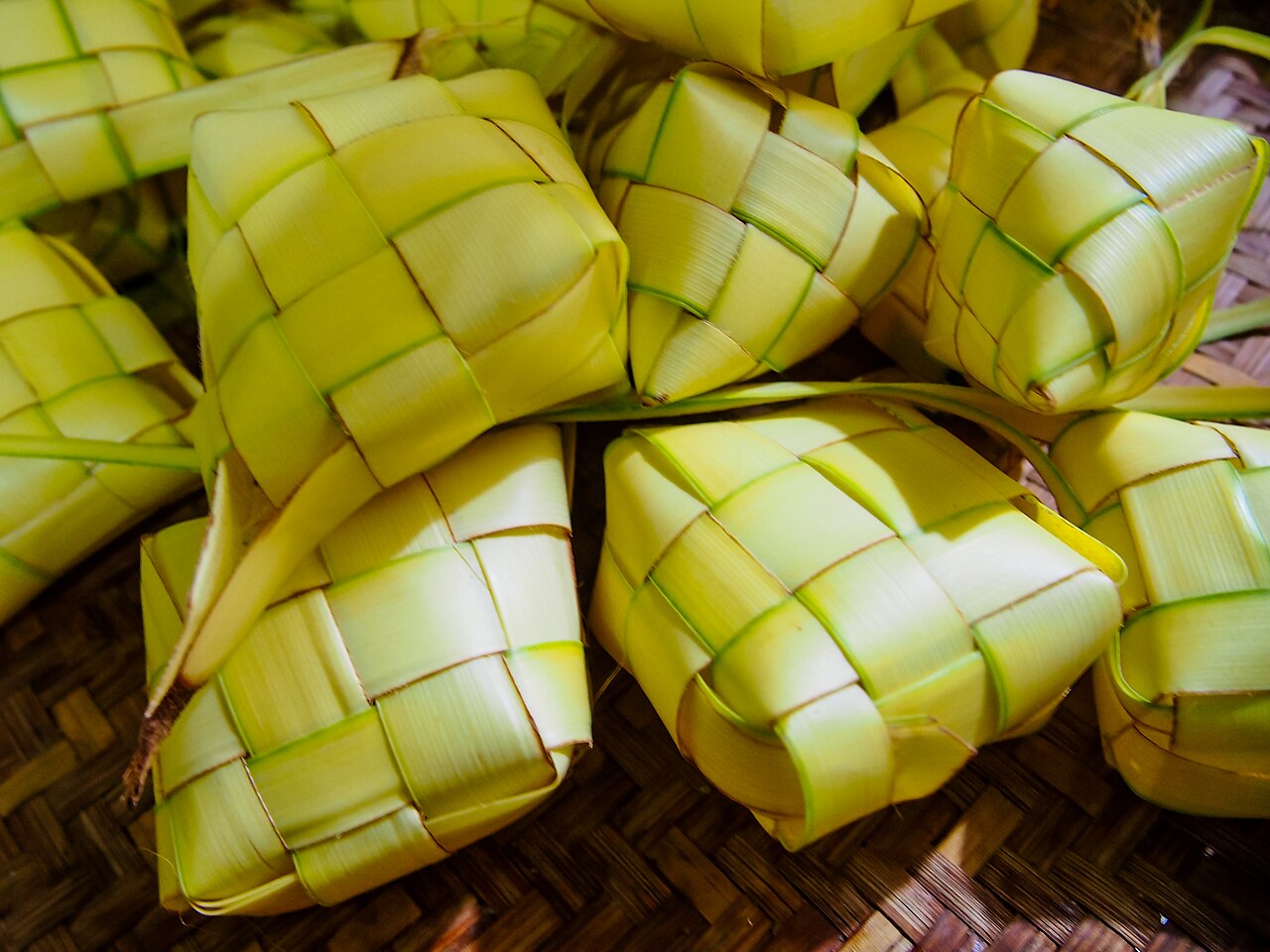 Woven palm-leaf ketupat parcels of compressed rice, served for Hari Raya