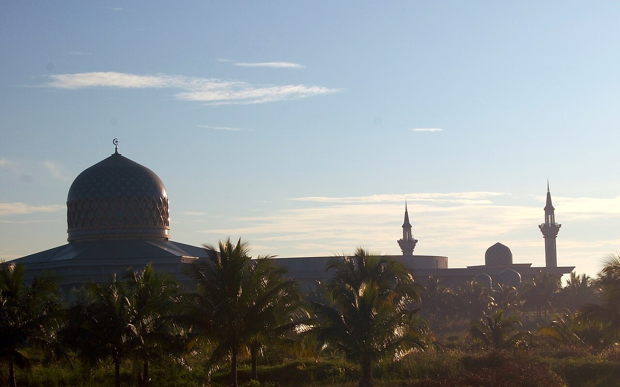 The blue dome and four minarets of the Sultan Salahuddin Abdul Aziz Mosque in Shah Alam