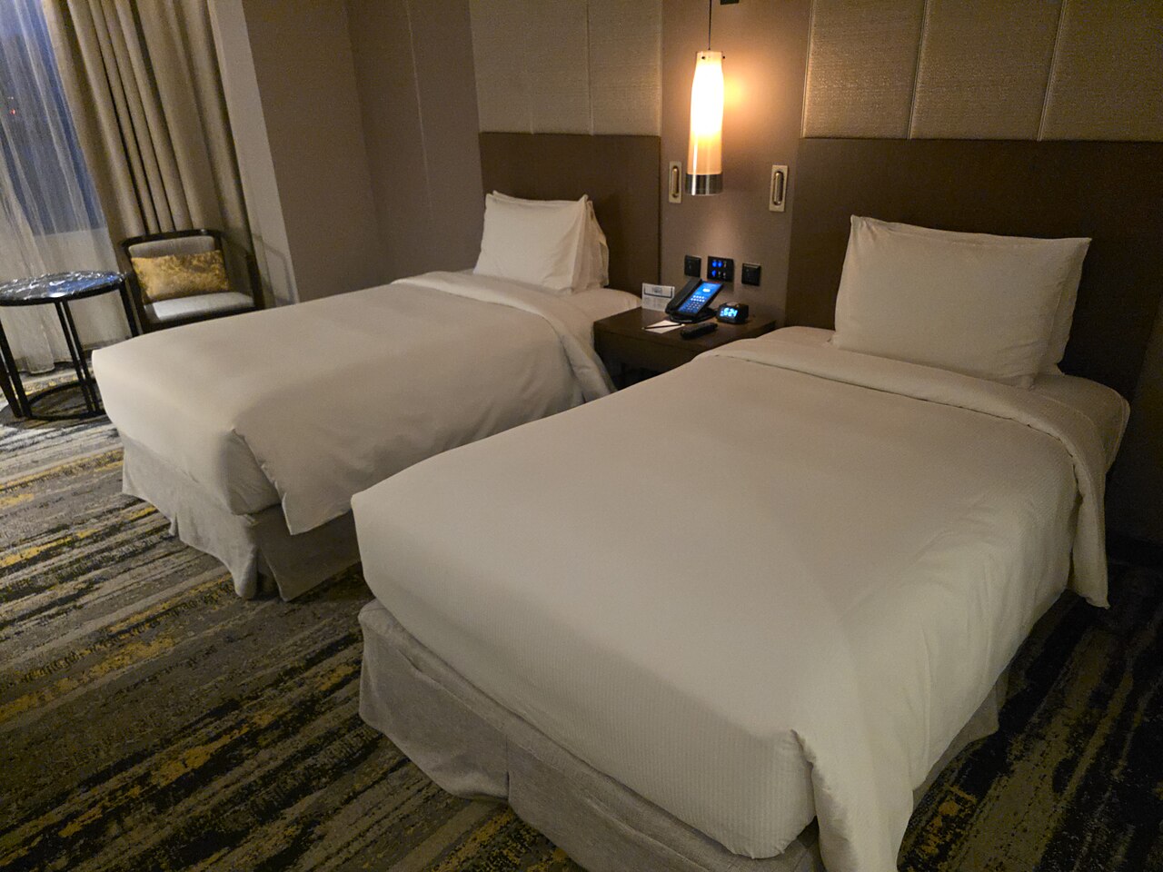 A twin-bed room in a four-star city hotel in Kota Kinabalu