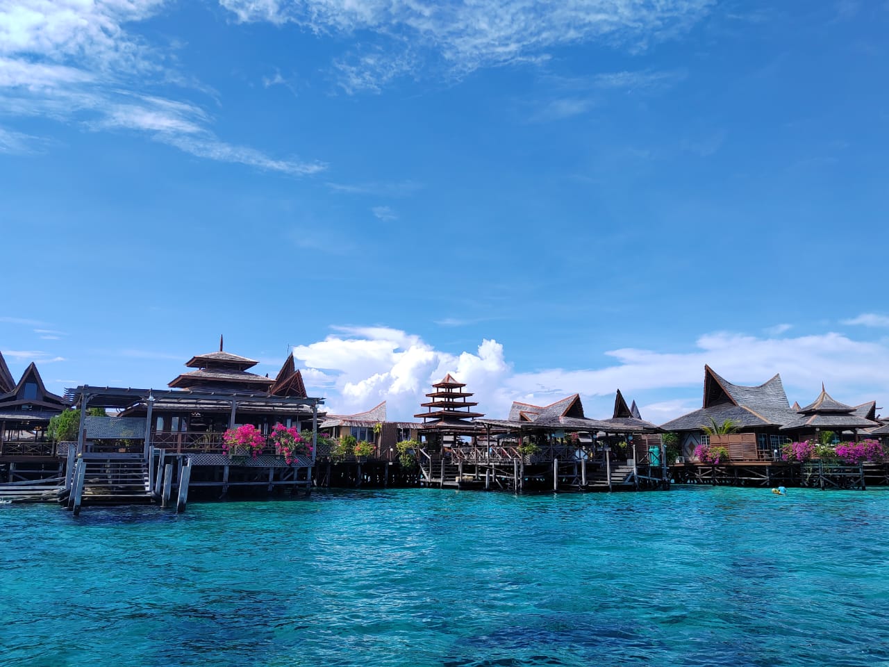 Water bungalow accommodation on stilts over the sea at Mabul Island near Semporna